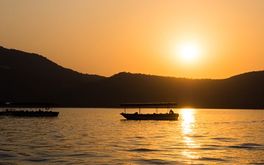 Sunset boat cruise udaipur landscape Image